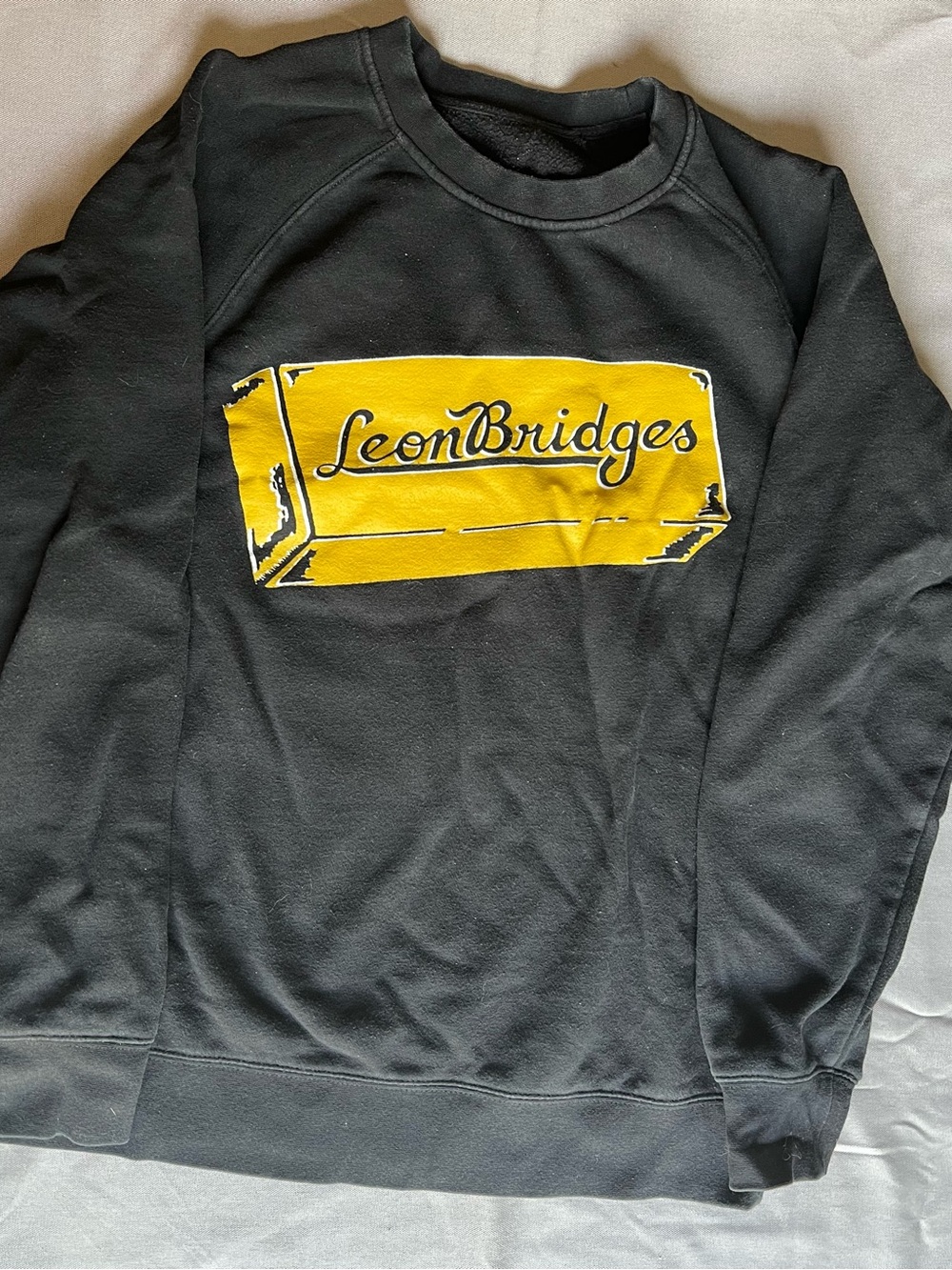 Black Crewneck Sweatshirt with Yellow Logo "Leon Bridges"